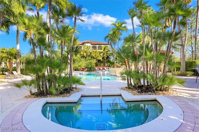 2738 Tiburon Blvd E Unit B406, Naples, FL 34109 - community pool with a patio