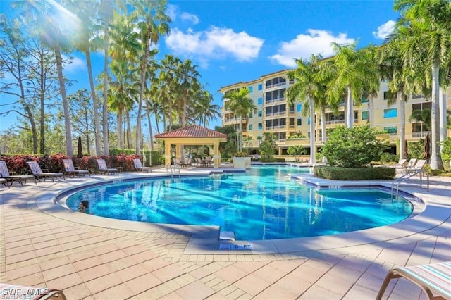 2738 Tiburon Blvd E Unit B406, Naples, FL 34109 - community pool featuring a gazebo and a patio area