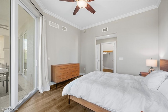 2738 Tiburon Blvd E Unit B406, Naples, FL 34109 - bedroom with wood finished floors, crown molding, access to exterior, and a ceiling fan