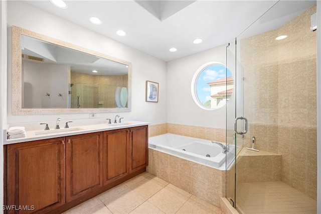 2738 Tiburon Blvd E Unit B406, Naples, FL 34109 - full bathroom with a whirlpool tub, a stall shower, tile patterned floors, double vanity, and recessed lighting