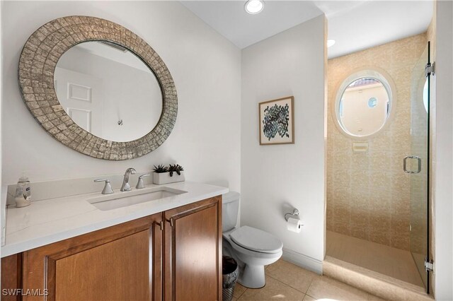 2738 Tiburon Blvd E Unit B406, Naples, FL 34109 - bathroom with vanity, tile patterned flooring, and a shower stall