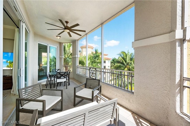 2738 Tiburon Blvd E Unit B406, Naples, FL 34109 - sunroom / solarium with ceiling fan, healthy amount of natural light, and an outdoor hangout area