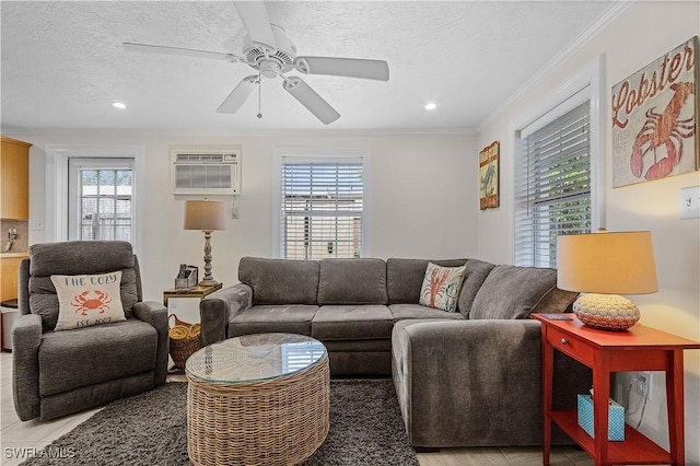 782 107th Ave N, Naples, FL 34108 - living room featuring ornamental molding, a textured ceiling, a wall unit AC, a ceiling fan, and recessed lighting