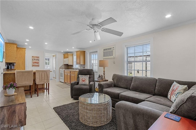 782 107th Ave N, Naples, FL 34108 - living area featuring a wall mounted air conditioner, a ceiling fan, recessed lighting, light tile patterned floors, and ornamental molding