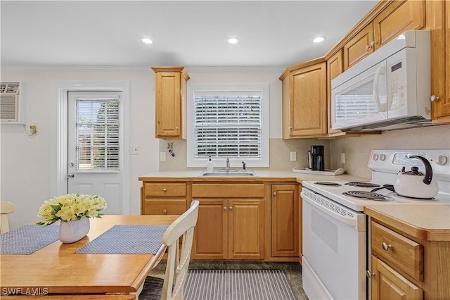 782 107th Ave N, Naples, FL 34108 - kitchen with white appliances, light countertops, crown molding, and recessed lighting