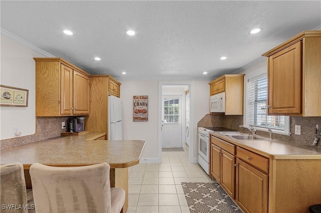 782 107th Ave N, Naples, FL 34108 - kitchen featuring white appliances, recessed lighting, a kitchen breakfast bar, a peninsula, and backsplash