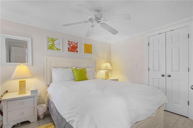782 107th Ave N, Naples, FL 34108 - bedroom featuring a closet, crown molding, a ceiling fan, and light tile patterned floors