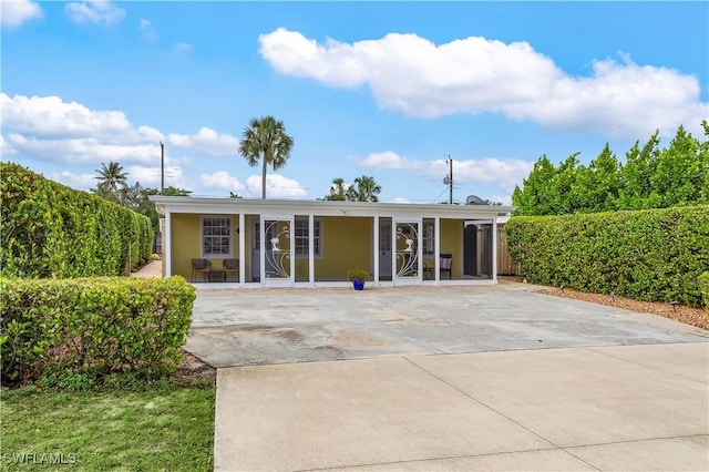 782 107th Ave N, Naples, FL 34108 - back of property featuring covered porch and stucco siding