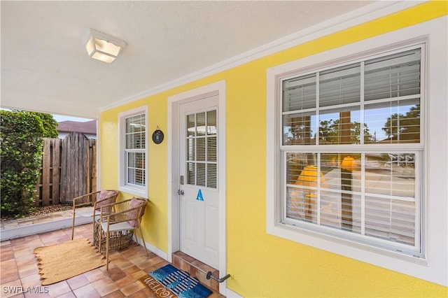 782 107th Ave N, Naples, FL 34108 - property entrance with covered porch and stucco siding