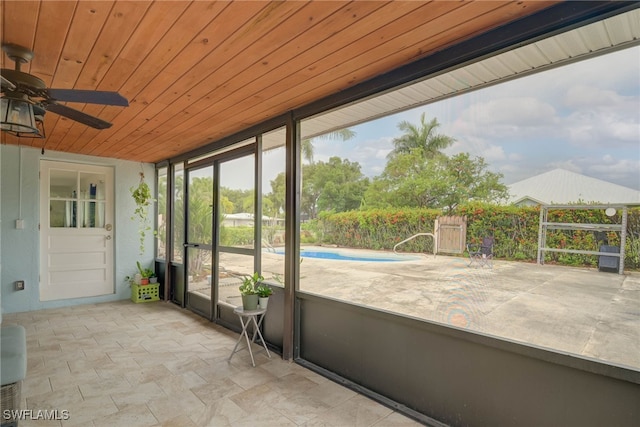 14539 Riverside Dr, Fort Myers, FL 33905 - unfurnished sunroom featuring a ceiling fan