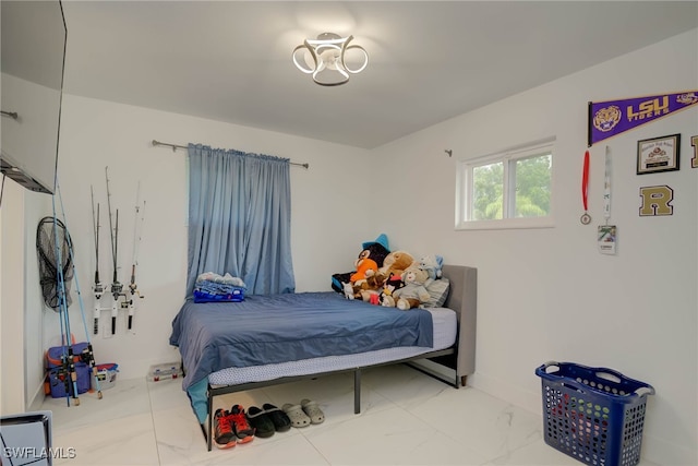 14539 Riverside Dr, Fort Myers, FL 33905 - bedroom with marble look tiles and baseboards