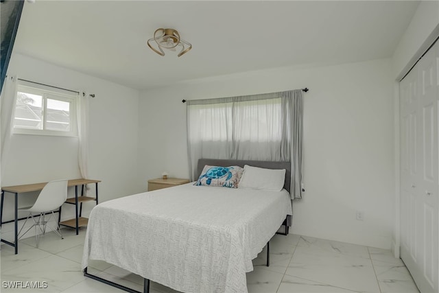 14539 Riverside Dr, Fort Myers, FL 33905 - bedroom with light marble finish flooring and a closet