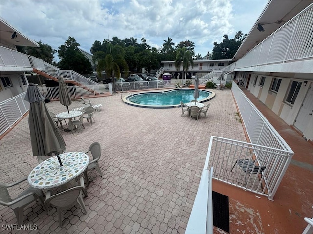 2590 1st St Unit 112, Fort Myers, FL 33901 - community pool featuring a patio area and stairway