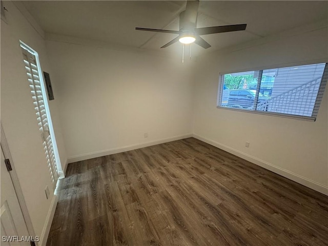2590 1st St Unit 112, Fort Myers, FL 33901 - unfurnished room featuring dark wood-style floors and a ceiling fan