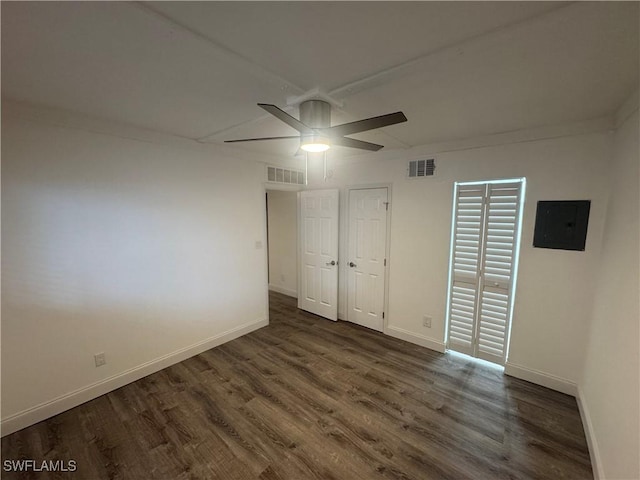 2590 1st St Unit 112, Fort Myers, FL 33901 - unfurnished room with electric panel, ceiling fan, and wood finished floors