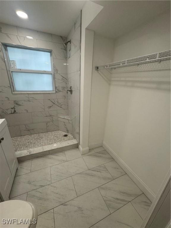 2590 1st St Unit 112, Fort Myers, FL 33901 - bathroom with marble finish floors, a marble finish shower, and vanity