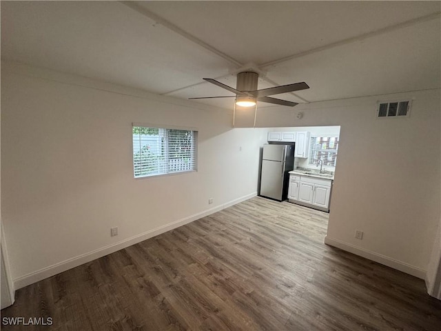 2590 1st St Unit 112, Fort Myers, FL 33901 - unfurnished room featuring ceiling fan and wood finished floors