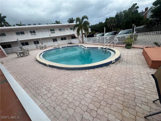 2590 1st St Unit 112, Fort Myers, FL 33901 - community pool featuring a patio