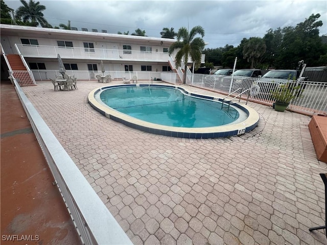 2590 1st St Unit 112, Fort Myers, FL 33901 - community pool featuring a patio area