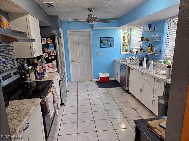 kitchen featuring stainless steel appliances, open shelves, a ceiling fan, white cabinetry, and a textured ceiling