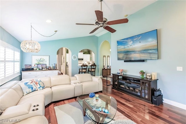 15139 Ligustrum Ln, Alva, FL 33920 - living room with arched walkways, wood finished floors, lofted ceiling, a ceiling fan, and a chandelier