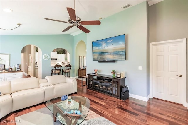 15139 Ligustrum Ln, Alva, FL 33920 - living room with arched walkways, vaulted ceiling, a ceiling fan, and wood finished floors