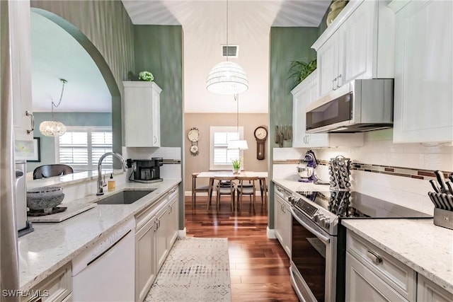15139 Ligustrum Ln, Alva, FL 33920 - kitchen with appliances with stainless steel finishes, dark wood finished floors, white cabinets, plenty of natural light, and a towering ceiling