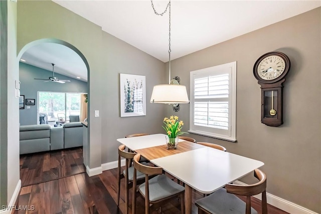 15139 Ligustrum Ln, Alva, FL 33920 - dining room featuring vaulted ceiling, dark wood-style flooring, arched walkways, and a ceiling fan