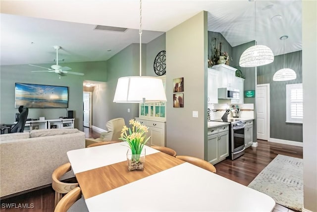 15139 Ligustrum Ln, Alva, FL 33920 - dining space with dark wood-style flooring, a ceiling fan, and high vaulted ceiling