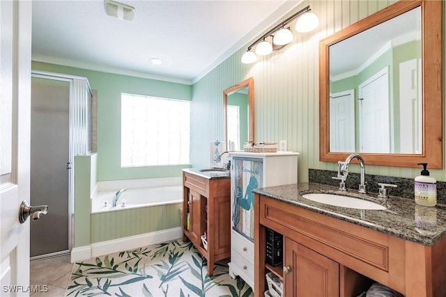 15139 Ligustrum Ln, Alva, FL 33920 - bathroom featuring ornamental molding, a garden tub, a stall shower, vanity, and tile patterned flooring