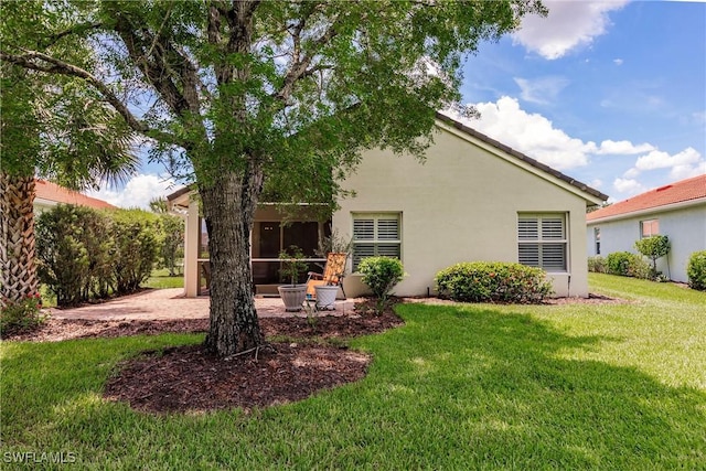 15139 Ligustrum Ln, Alva, FL 33920 - back of property with a yard and stucco siding