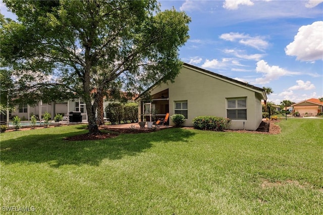 15139 Ligustrum Ln, Alva, FL 33920 - back of property with stucco siding and a yard