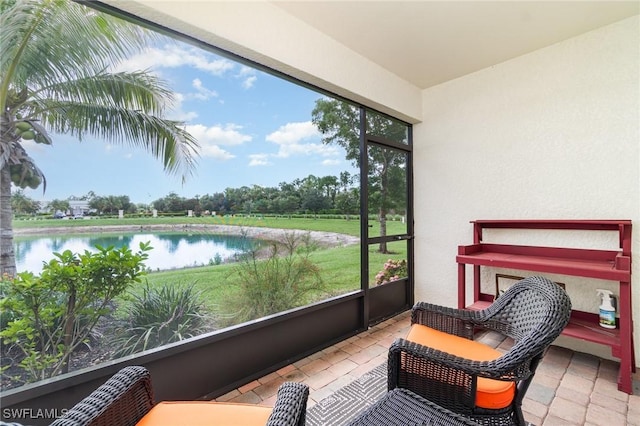 20095 Fiddlewood Ave, North Fort Myers, FL 33917 - sunroom / solarium featuring a water view