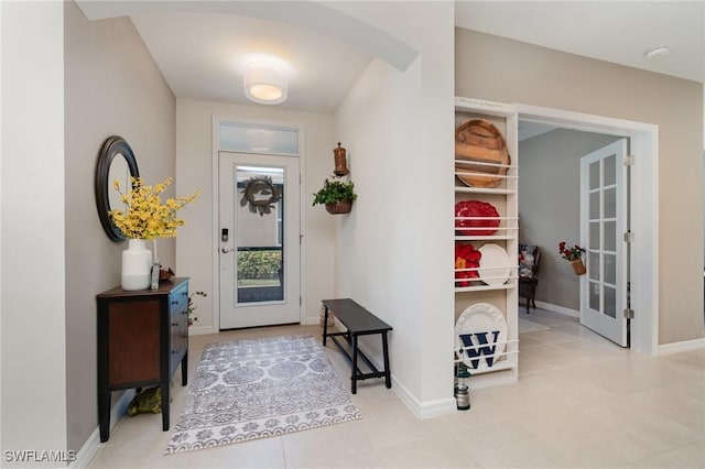 20095 Fiddlewood Ave, North Fort Myers, FL 33917 - entrance foyer with light tile patterned flooring and arched walkways
