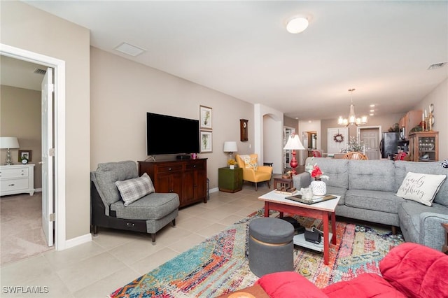 20095 Fiddlewood Ave, North Fort Myers, FL 33917 - living area featuring a chandelier and light tile patterned floors