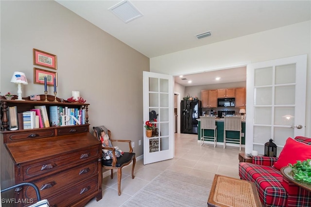 20095 Fiddlewood Ave, North Fort Myers, FL 33917 - living area featuring french doors and light tile patterned floors