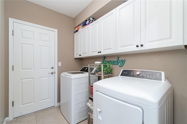 20095 Fiddlewood Ave, North Fort Myers, FL 33917 - laundry area with washing machine and dryer, cabinet space, and light tile patterned flooring