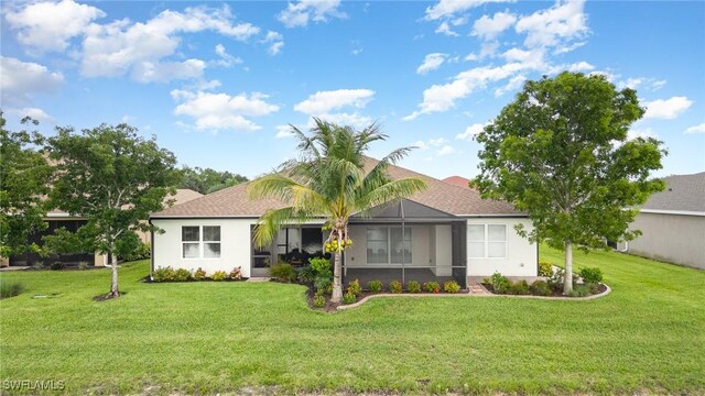 20095 Fiddlewood Ave, North Fort Myers, FL 33917 - view of front of house with a front lawn and stucco siding