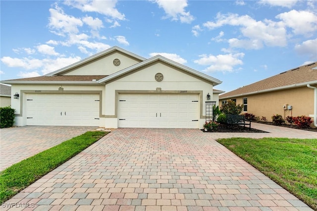 20095 Fiddlewood Ave, North Fort Myers, FL 33917 - ranch-style home with stucco siding and decorative driveway