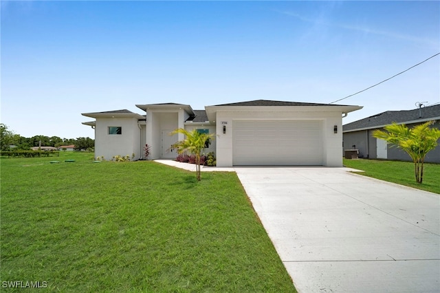 3706 16th St W, Lehigh Acres, FL 33971 - prairie-style home with concrete driveway, stucco siding, a front lawn, and an attached garage