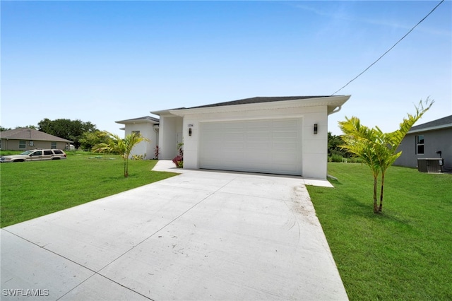 3706 16th St W, Lehigh Acres, FL 33971 - view of front of house featuring driveway, a front lawn, a garage, and stucco siding