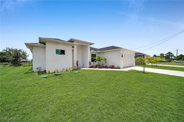 3706 16th St W, Lehigh Acres, FL 33971 - prairie-style house featuring driveway, a garage, a front lawn, and stucco siding