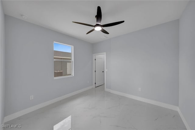 3706 16th St W, Lehigh Acres, FL 33971 - spare room with marble finish flooring, ceiling fan, and a smoke detector
