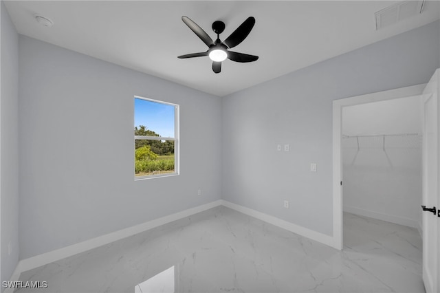 3706 16th St W, Lehigh Acres, FL 33971 - unfurnished room featuring light marble finish floors, ceiling fan, and a smoke detector