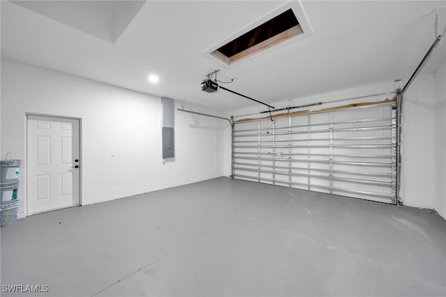 3706 16th St W, Lehigh Acres, FL 33971 - garage featuring electric panel and a garage door opener