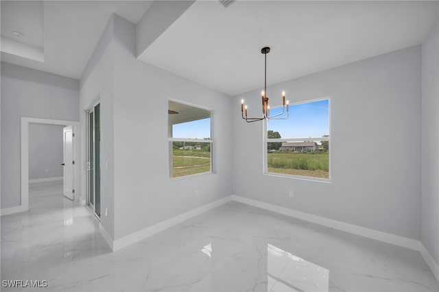 3706 16th St W, Lehigh Acres, FL 33971 - spare room with marble tiled flooring and a chandelier