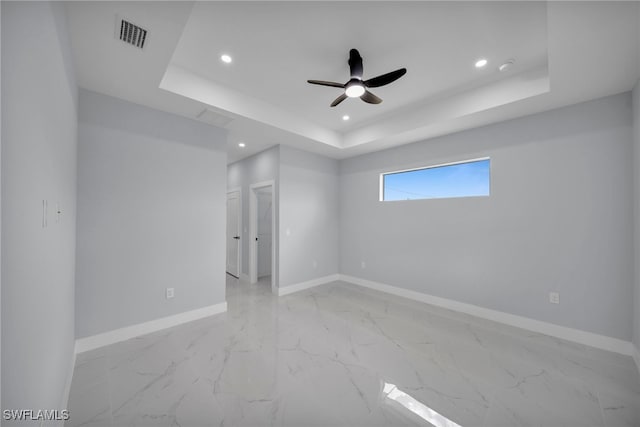 3706 16th St W, Lehigh Acres, FL 33971 - spare room with recessed lighting, a raised ceiling, ceiling fan, and light marble finish floors