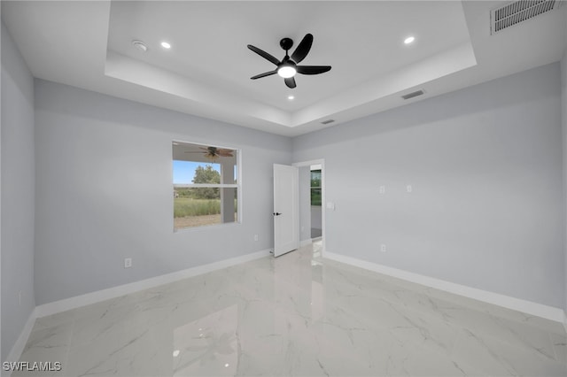3706 16th St W, Lehigh Acres, FL 33971 - unfurnished room featuring a raised ceiling, a ceiling fan, recessed lighting, a smoke detector, and light marble finish floors