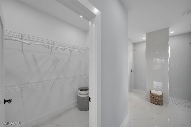 3706 16th St W, Lehigh Acres, FL 33971 - bathroom with marble finish floors, a marble finish shower, recessed lighting, and a walk in closet