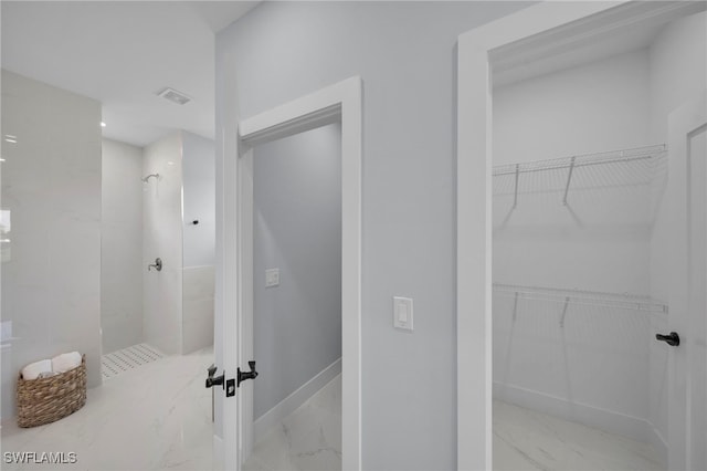 3706 16th St W, Lehigh Acres, FL 33971 - bathroom featuring marble tiled floors, a walk in shower, and a spacious closet